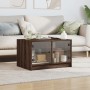 Mesa de centro con puertas de vidrio marrón roble 68x50x42 cm de , Mesas de centro - Ref: Foro24-836370, Precio: 45,56 €, Des...