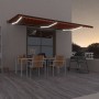 Toldo retráctil manual con luz LED naranja y marrón 600x350 cm de , Toldos - Ref: Foro24-3069245, Precio: 606,26 €, Descuento: %
